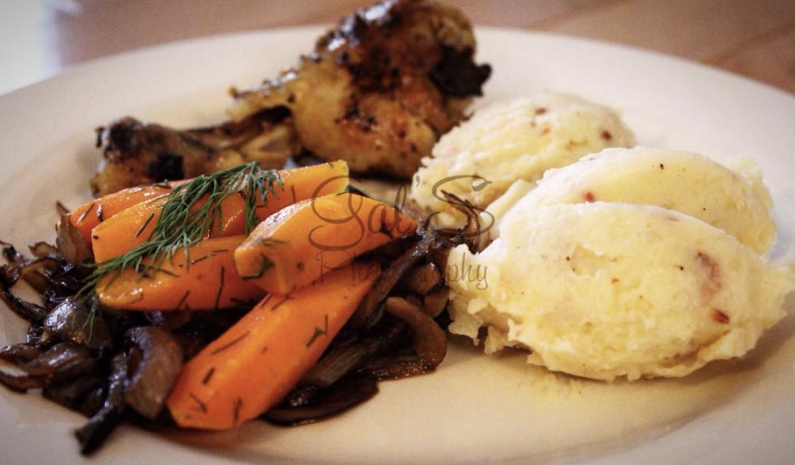 Aromatic combination of Baby carrots over a bed of pan-braised onions.